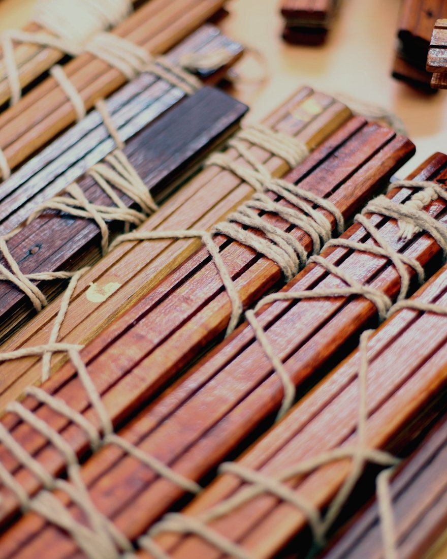Rows of cord-bound palm-leaf bundles stacked in the library