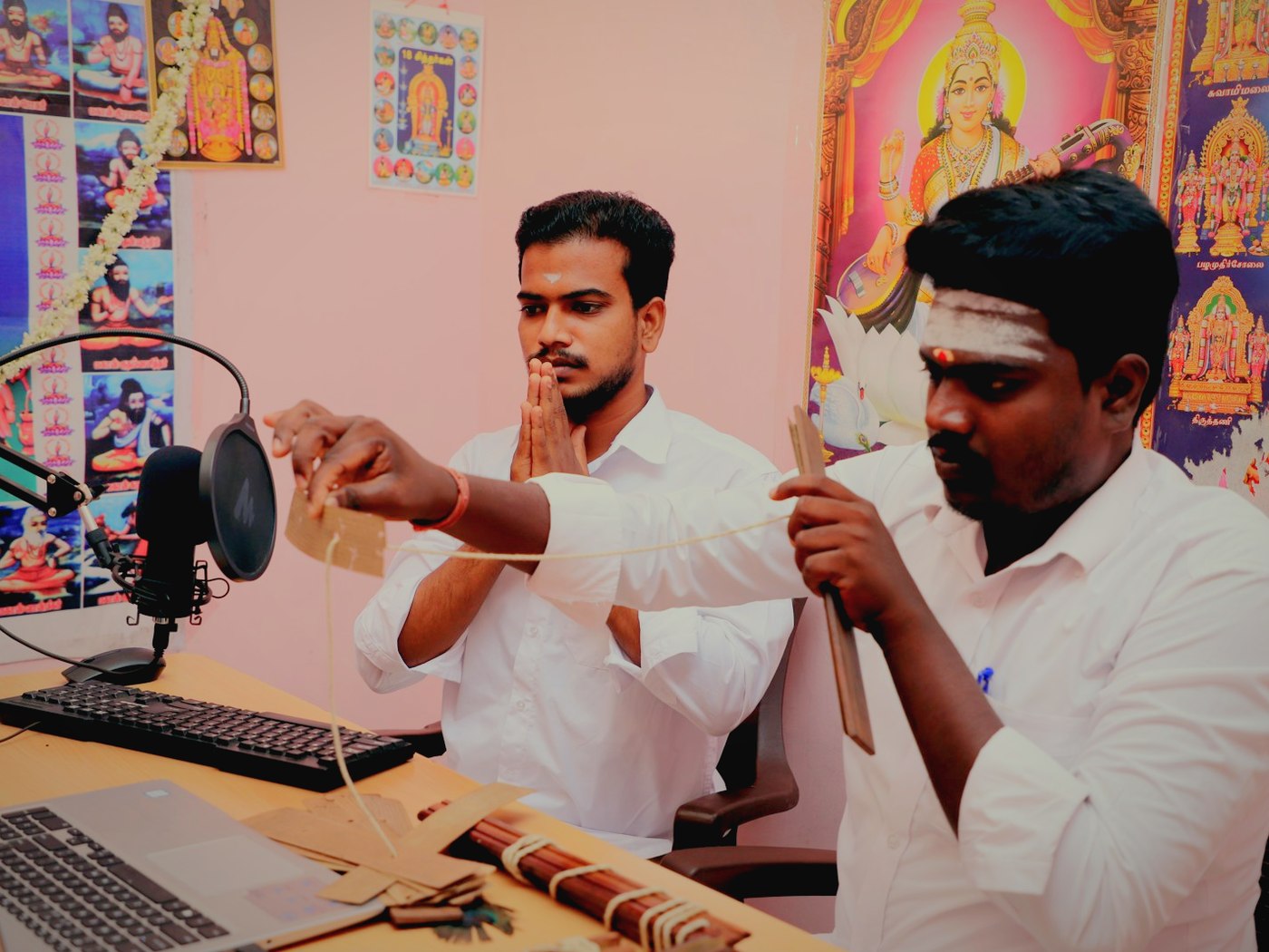 The reading room in Tamil Nadu: microphone, screen and the bundles on the desk